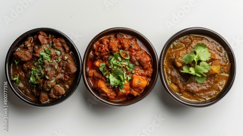 Delectable Indian curry selection, rich in spices, featuring both vegetarian and meat options, studio lighting