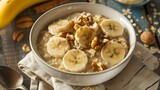  A bowl of creamy oatmeal topped with sliced bananas, nuts, and a sprinkle of cinnamon, promising a comforting yet nutritious breakfast. 
