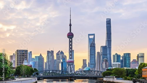 Time-lapse of modern city buildings and natural landscape in downtown Shanghai photo