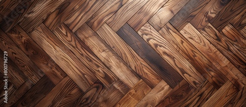 Wooden floor displays an intricate herringbone pattern design, adding elegance and texture to the room