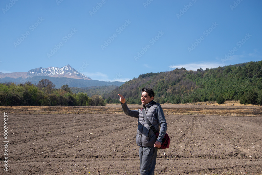 Traveler Pointing Towards Nevado de Toluca Volcano Traveler Pointing Towards Nevado de Toluca Volcano