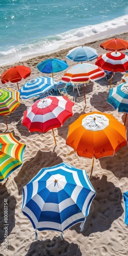 stripy parasols on sand beach