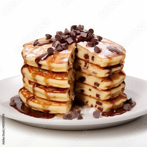  delicious fluffy chocolate chip pancakes with the topping of butter and sugar syrup on a plate with a slice cut out white background © Muhammad Hammad Zia