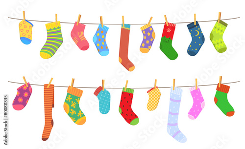 Color cotton and wool socks on clothesline. Socks hanging on a rope with clothepins. Family laundry on a rope, color clothing on clothesline or cartoon vector wool socks hanging and drying