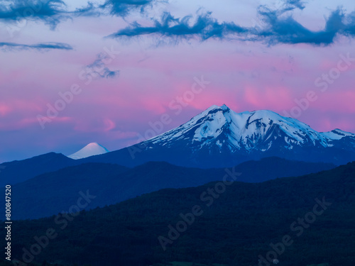 Calbuco volcano and Osorno volcano in the blue hour after sunset. beautiful colored clouds