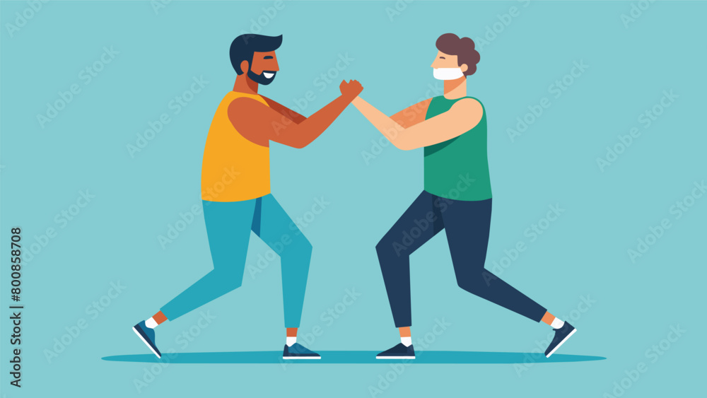 Fototapeta premium Two men stand facing each other engaged in a partner stretching exercise that requires trust and communication as they support each others weight..