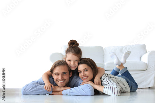 Young Caucasian family with small daughter pose relax on floor on a transparent background