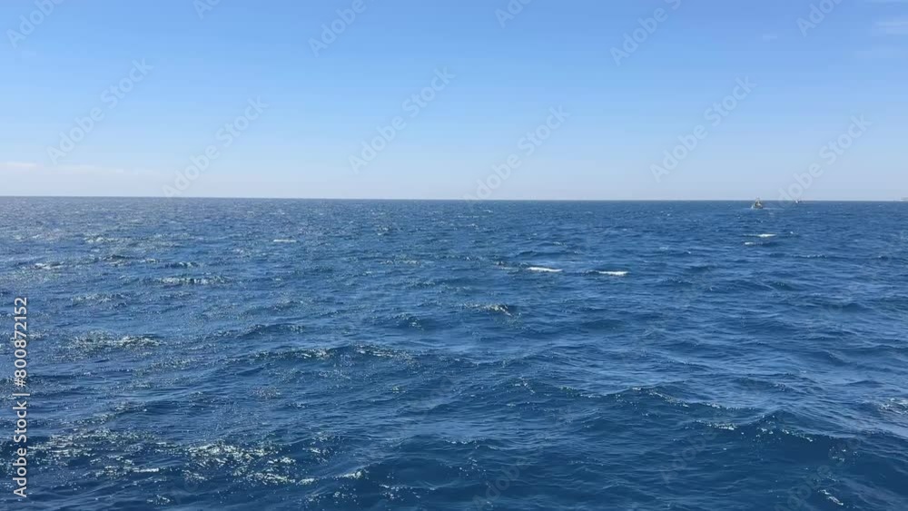 Looking out into the Mediterranean Sea following a fishing boat Looking out into the Mediterranean Sea following a fishing boat