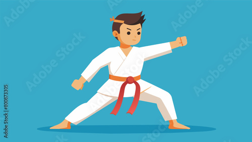 A student wearing an orange belt showing their dedication and hard work in mastering the fundamentals of karate.