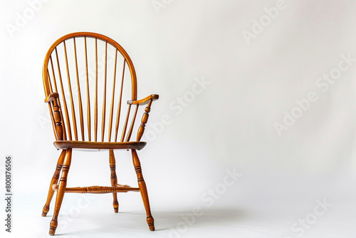 A modern twist on a Windsor chair showcased against a solid white backdrop, isolated on solid white background.