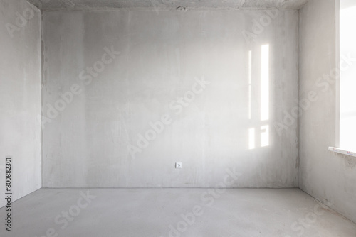 interior of the apartment without decoration in gray colors. rough finish