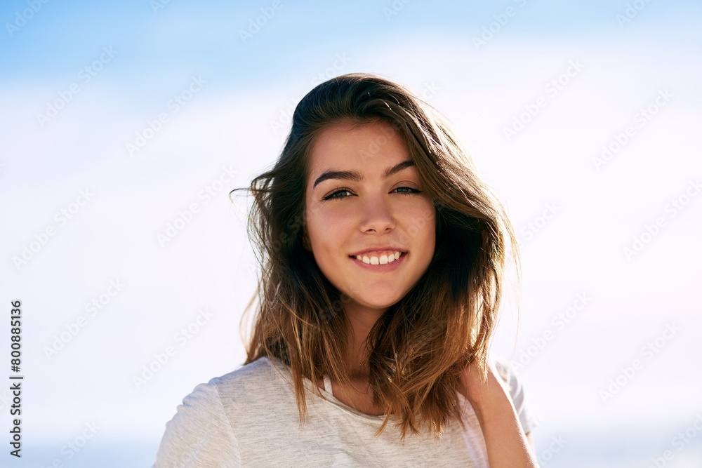 Portrait, happy and woman on holiday with sky in nature, relax and smile face with tourist on the beach. Paradise, travel and weekend getaway, confident and calm or Colombian female person in summer Portrait, happy and woman on holiday with sky in nature, relax and smile face with tourist on the beach. Paradise, travel and weekend getaway, confident and calm or Colombian female person in summer