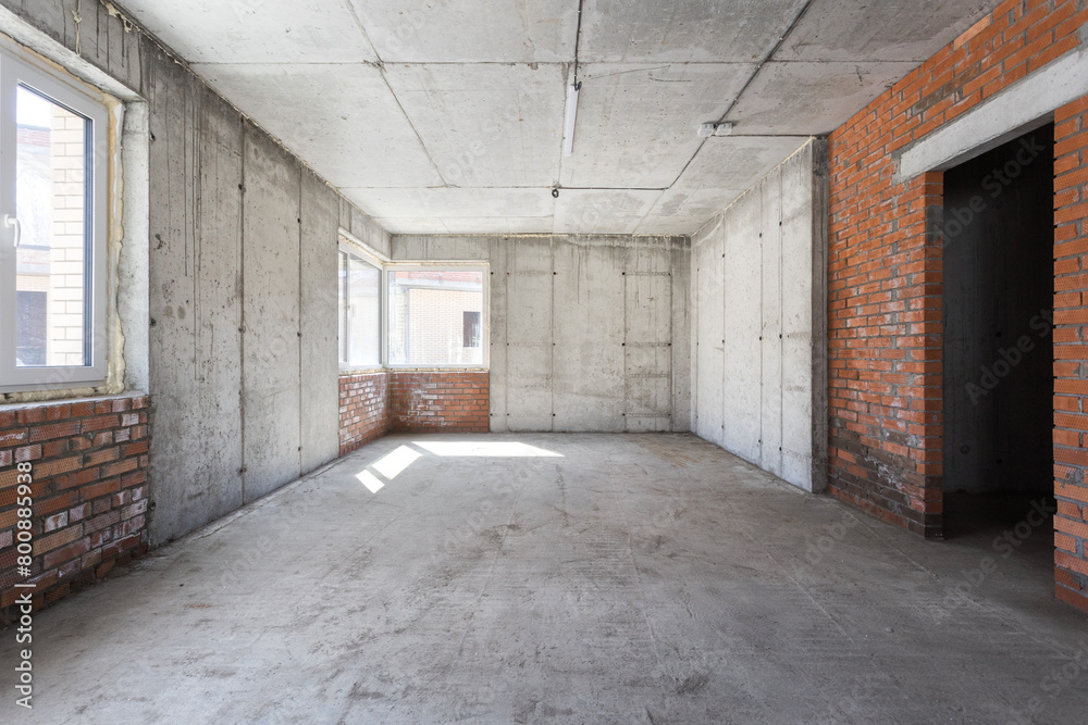 interior of the apartment without decoration in gray colors. rough finish