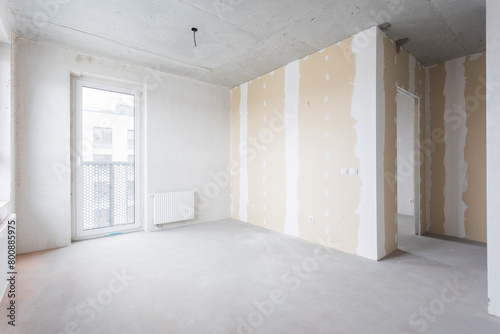 interior of the apartment without decoration in gray colors. rough finish