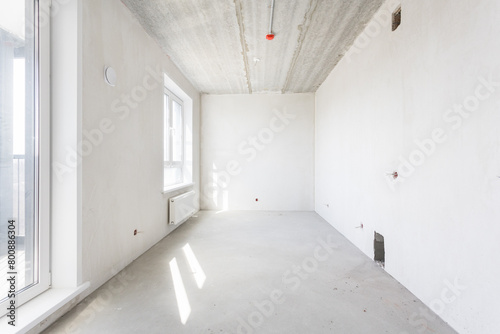 interior of the apartment without decoration in gray colors. rough finish