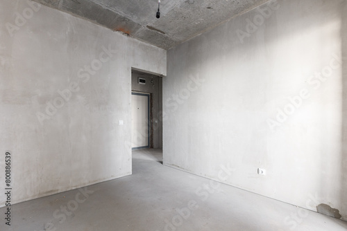 interior of the apartment without decoration in gray colors. rough finish