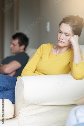 Stress, marriage and sad couple on sofa in home with anger, argument or fight in living room. Mental health, frustrated woman and man on couch with toxic relationship, divorce or marriage in crisis.
