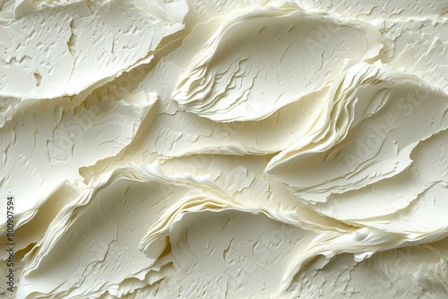 Close-up of a white, textured surface with a creamy consistency photo