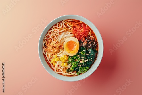 A bowl of ramen noodles with an egg on top photo