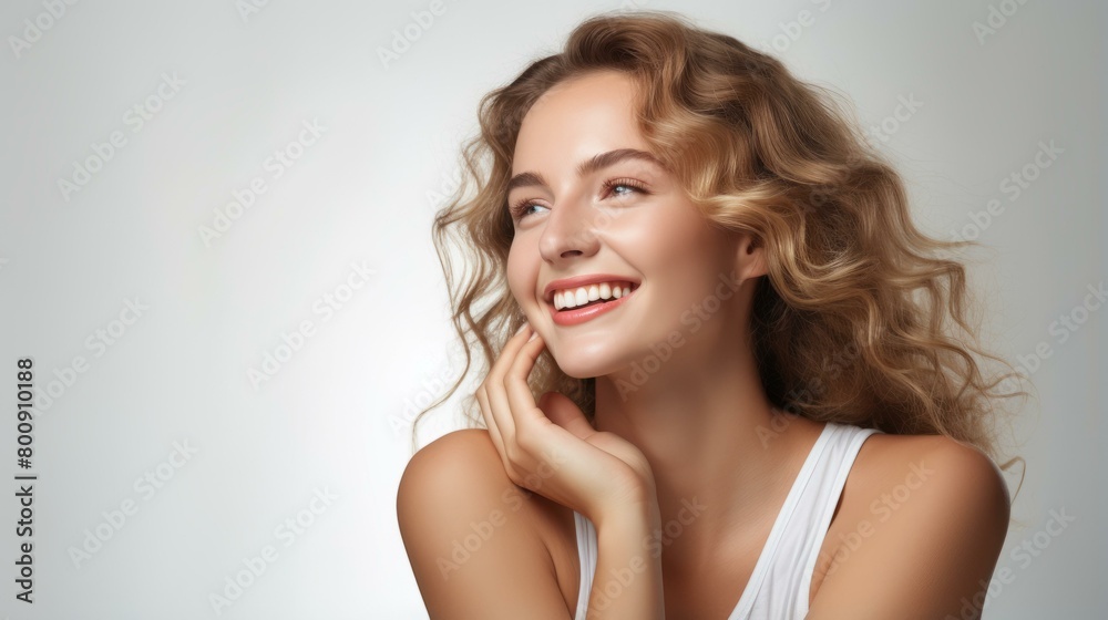 Portrait of a beautiful young woman with long blond hair and blue eyes smiling Portrait of a beautiful young woman with long blond hair and blue eyes smiling