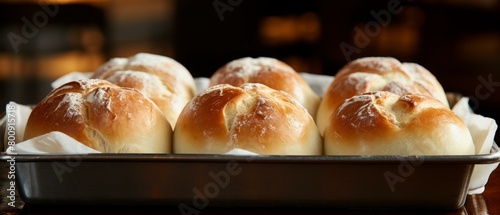 Freshly baked bread rolls in a baking tray