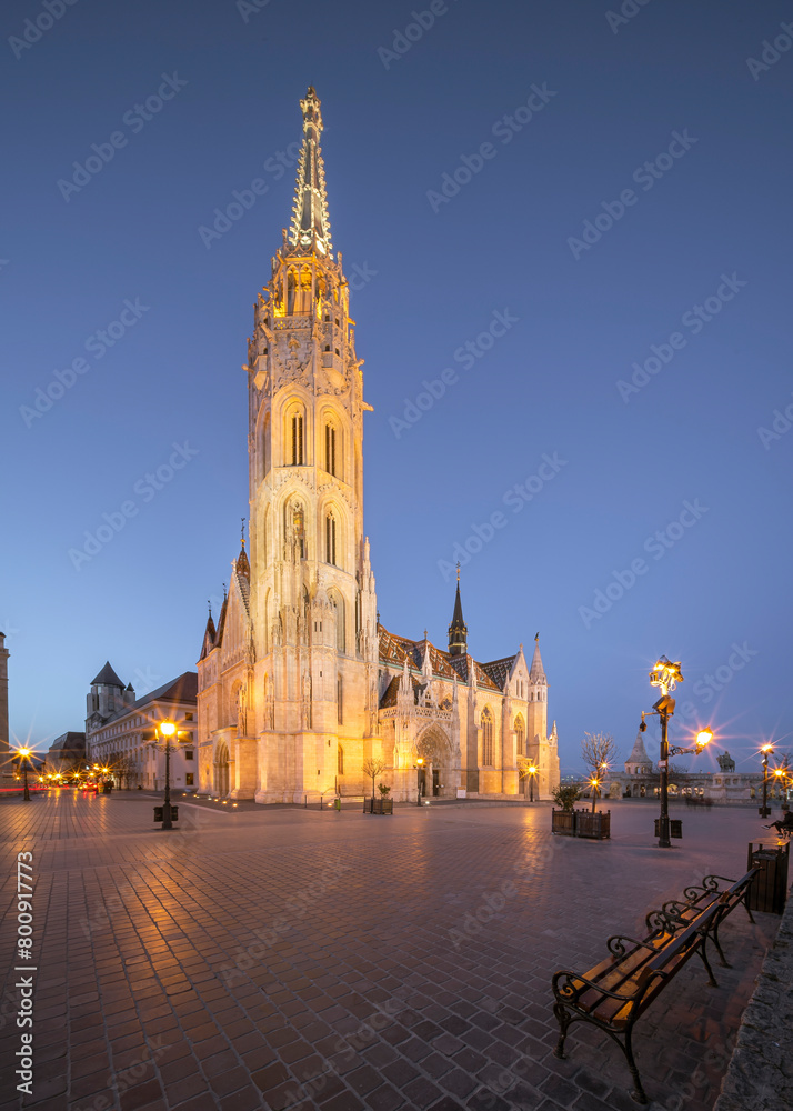 Evening cityscape about Budapest with the illuminated  Matthias church. Amazing attraction in Buda castle district next to Fishermans bastion. Hungarian name is Matyas templom.