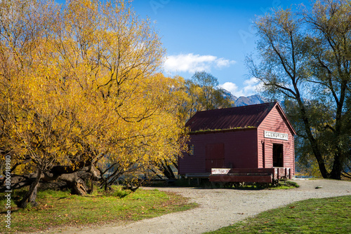 Glenorchy red wharf building and autumn scenery near the lake at Glenorchy, New Zealand photo
