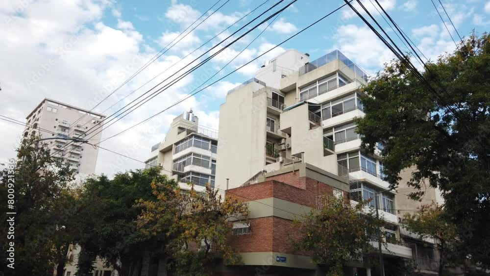 Modern tall buildings agains small houses in Buenos Aires city gentrification concept, town after massive demolish and construction process Modern tall buildings agains small houses in Buenos Aires city gentrification concept, town after massive demolish and construction process