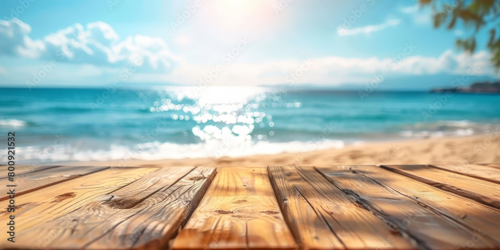 Fototapeta premium Empty wooden table top with blurred beach background for product display, vacation and travel concept. summer banner template.