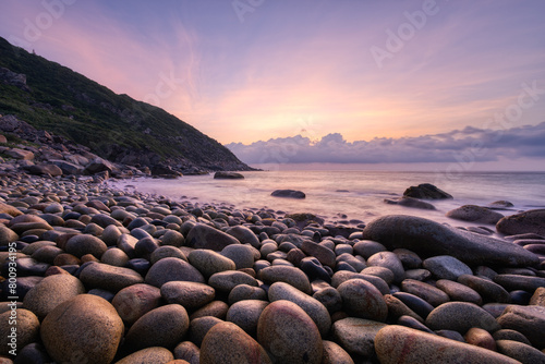 Photography Sunrise sea view on pebble beach