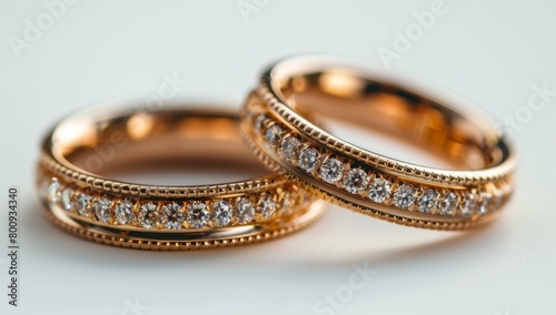 Symbol of Everlasting Love: Golden Wedding Rings Sparkling on White Background