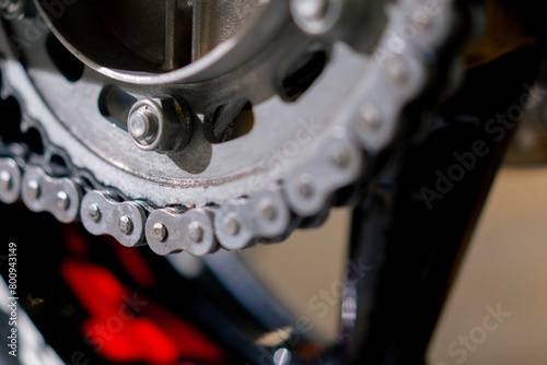 close-up on motorcycle base in a repair shop part of a motorbike with a track for activating the motor