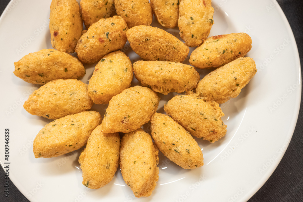 traditional appetizer of the portuguese gastronomy made with codfish, bolinhos de bacalhau. Typical food