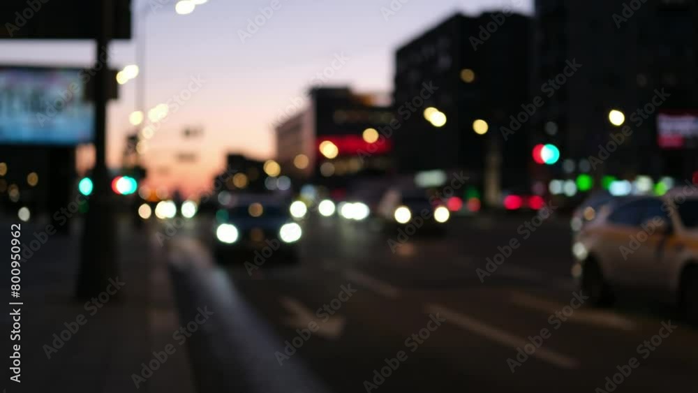 Defocused image of car traffic at dusk Defocused image of car traffic at dusk