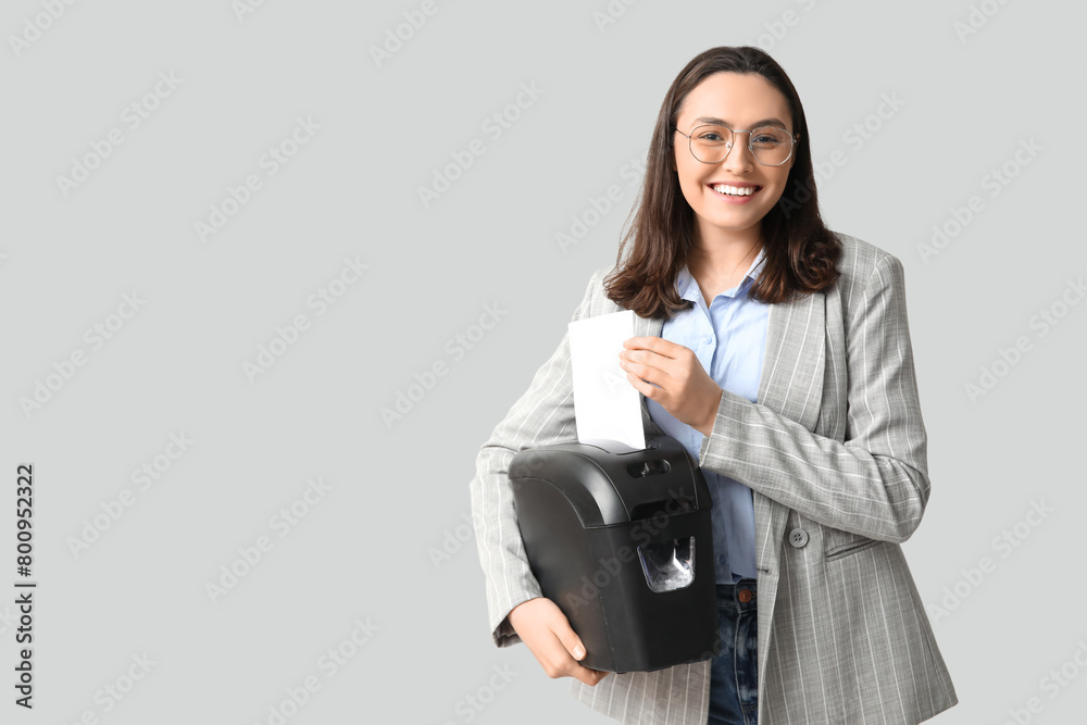 Secretary with shredder on light background Secretary with shredder on light background