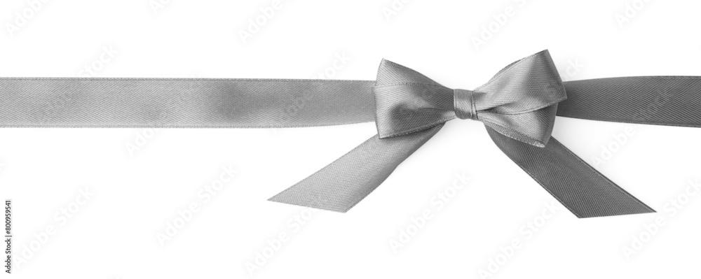 Grey satin ribbon with bow on white background, top view Grey satin ribbon with bow on white background, top view
