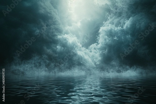 Ethereal clouds and mist, resembling the divine spirit, hover above a dark, mysterious body of water. photo