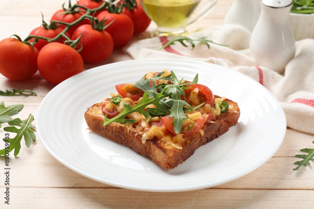 Tasty pizza toasts and ingredients on light wooden table