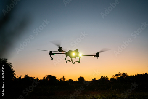 drone is flying over the field. twilight scene © vaakim