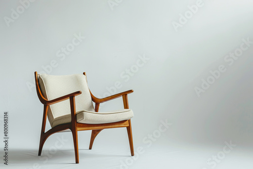 A sleek ladderback chair on a solid white backdrop.