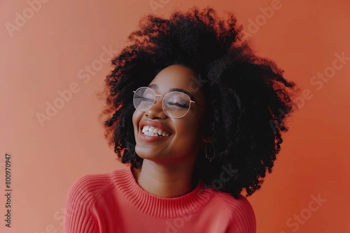 Happy young woman with afro hairstyle standing over one color background - generative ai