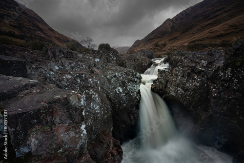 Waterfall in Glen Etive with dramatic scenery. Located in Glen Etive  Highlands  Scotland.