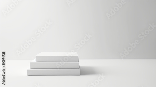 Three blank white books stacked on a clean white background  representing simplicity and minimalism