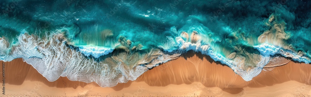 Aerial view of a long sandy beach in Africa with the ocean waves crashing on the shore