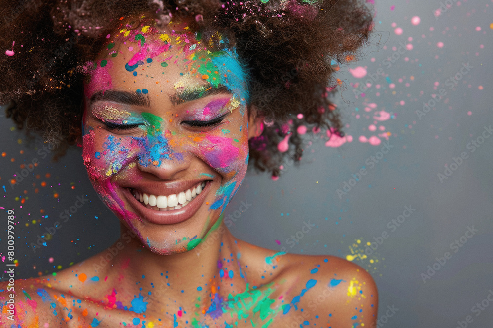 A woman with colorful face paint is smiling