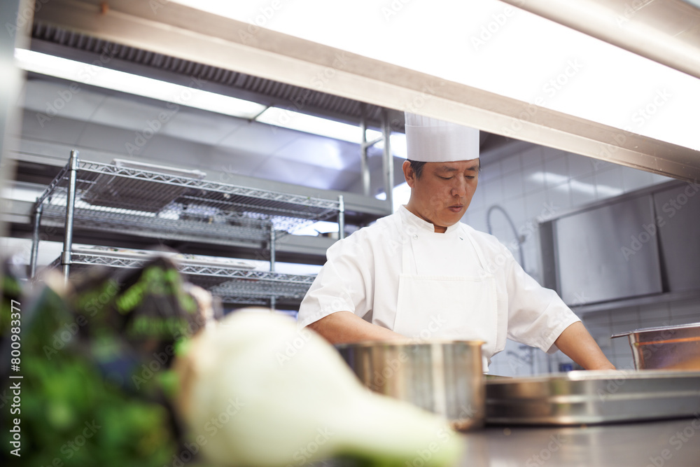 Professional, chef and asian man in kitchen for cooking, catering and serving food in restaurant. Business, culinary or male expert with cookware for hospitality, service and culinarian in uniform Professional, chef and asian man in kitchen for cooking, catering and serving food in restaurant. Business, culinary or male expert with cookware for hospitality, service and culinarian in uniform