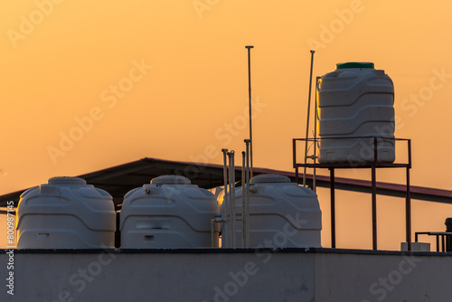Urban Living: Rooftop View of Overhead Water Tank and Metal Staircase in Dehradun, India