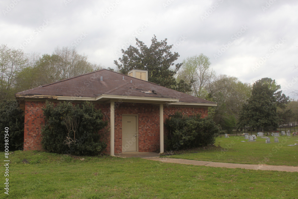 Spooky Abandoned Building in Rural Cemetery on Rainy Day Spooky Abandoned Building in Rural Cemetery on Rainy Day