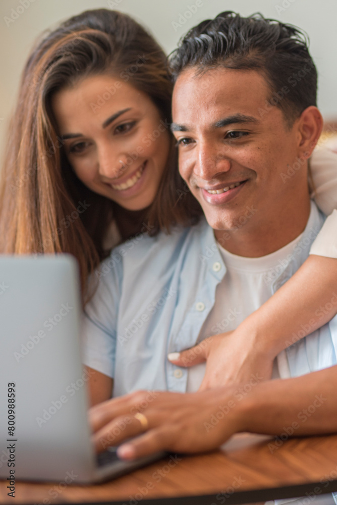 Cheerful Millennial Mixed Couple Spending Time With Laptop At Home, Happy Young Interracial Lovers Sitting On Floor With Computer, working Or Shopping Online Together, Man and woman together indoor Cheerful Millennial Mixed Couple Spending Time With Laptop At Home, Happy Young Interracial Lovers Sitting On Floor With Computer, working Or Shopping Online Together, Man and woman together indoor