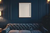 A single blank frame hangs above a contemporary sofa in a cozy den